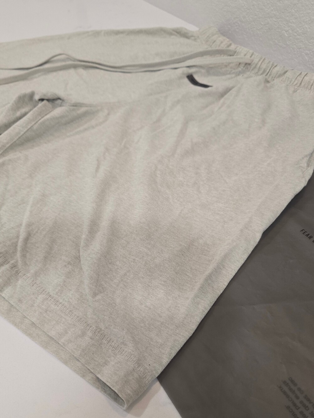 FEAR OF GOD - ESSENTIALS BASKETBALL JERSEY SHORTS - Heather Stone